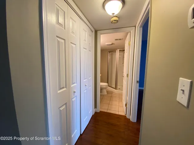 a view of a bathroom from a hallway