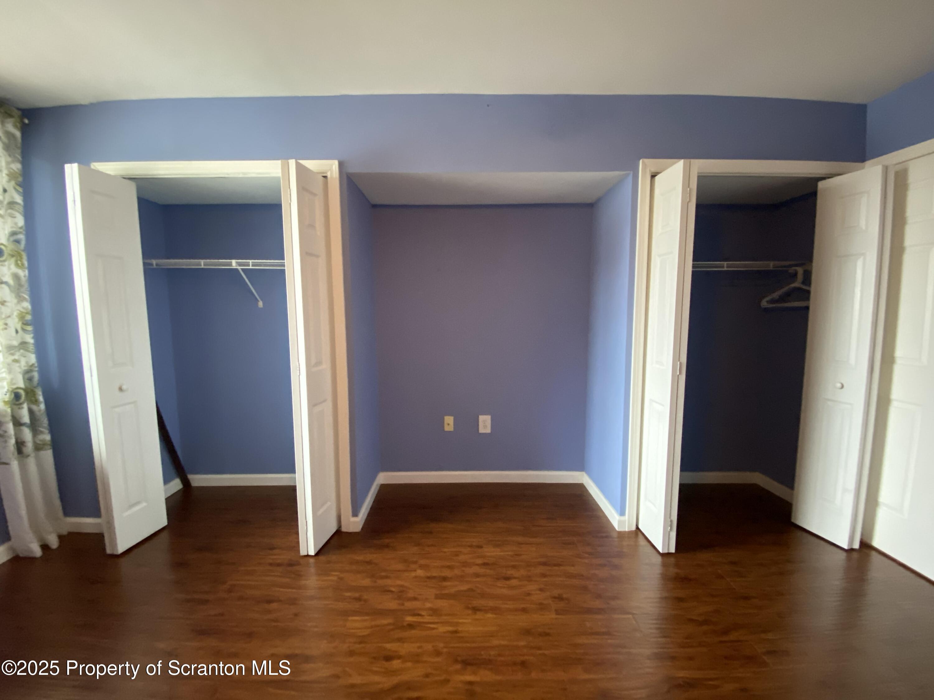 1702 Summit Pointe Scranton, PA 18508 - Photo 21 of 29 an empty room with wooden floor and closet