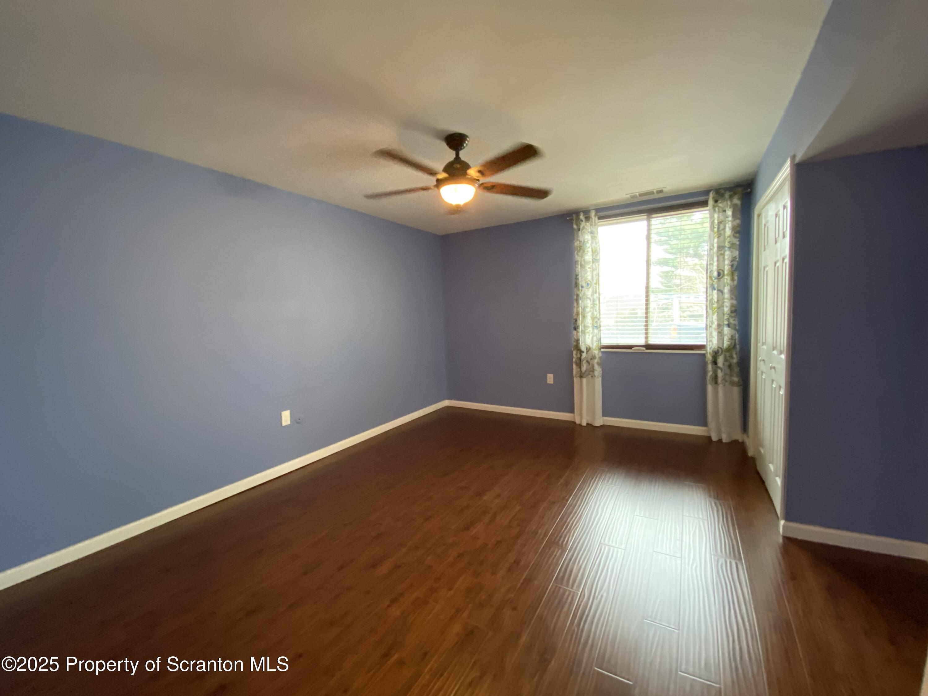 1702 Summit Pointe Scranton, PA 18508 - Photo 22 of 29 wooden floor in an empty room with a window