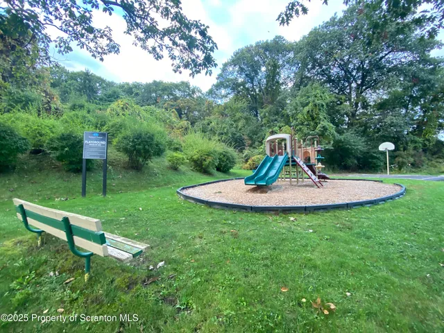a view of a park with a slide