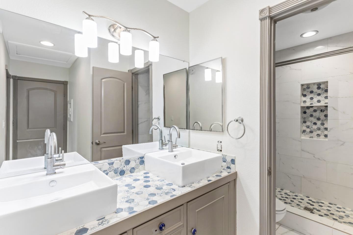 5510 Armitos Avenue, Unit 4 Goleta, CA 93117 - Photo 16 of 23 a bathroom with a sink double vanity and a mirror