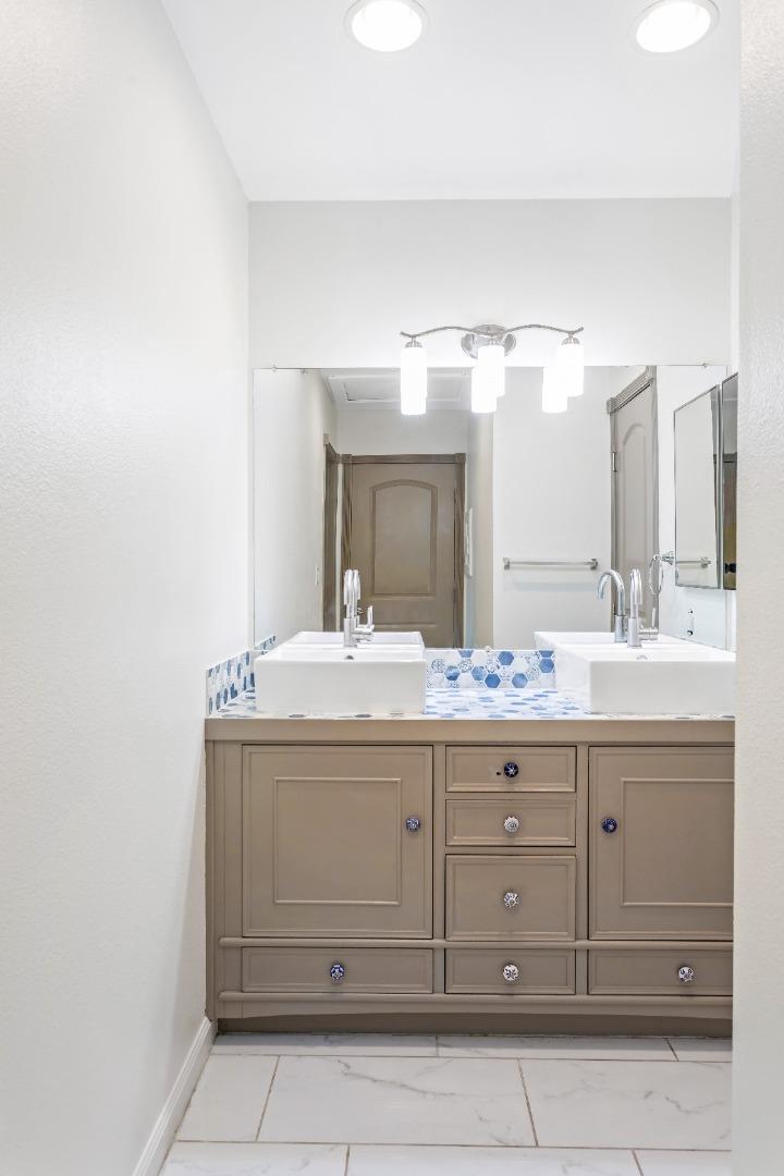 5510 Armitos Avenue, Unit 4 Goleta, CA 93117 - Photo 18 of 23 a bathroom with a sink vanity and mirror