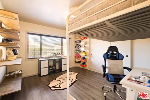 a view of a livingroom with furniture and a window
