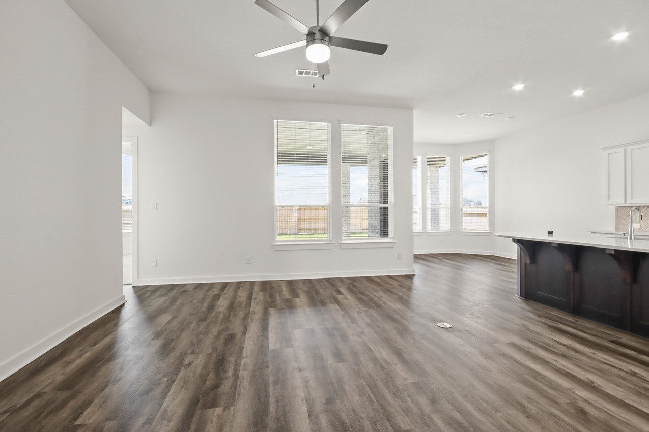 16538 Mandora Lane Conroe, TX 77302 - Photo 11 of 22 a view of an empty room with window and wooden floor