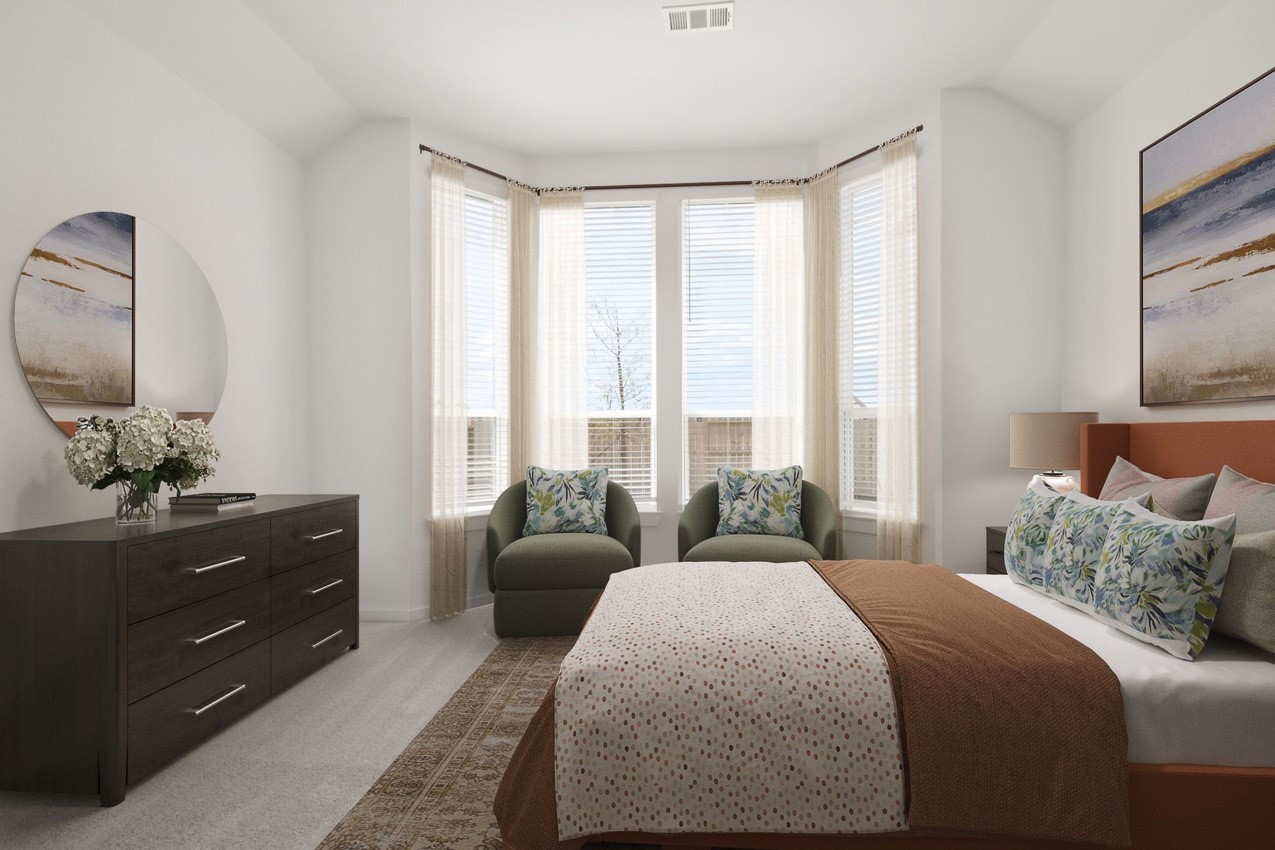 16538 Mandora Lane Conroe, TX 77302 - Photo 12 of 22 a bedroom with a bed and a dresser next to a window