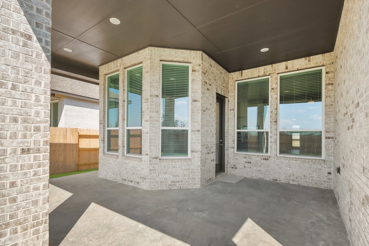 16538 Mandora Lane Conroe, TX 77302 - Photo 15 of 22 a view of a big room with large windows