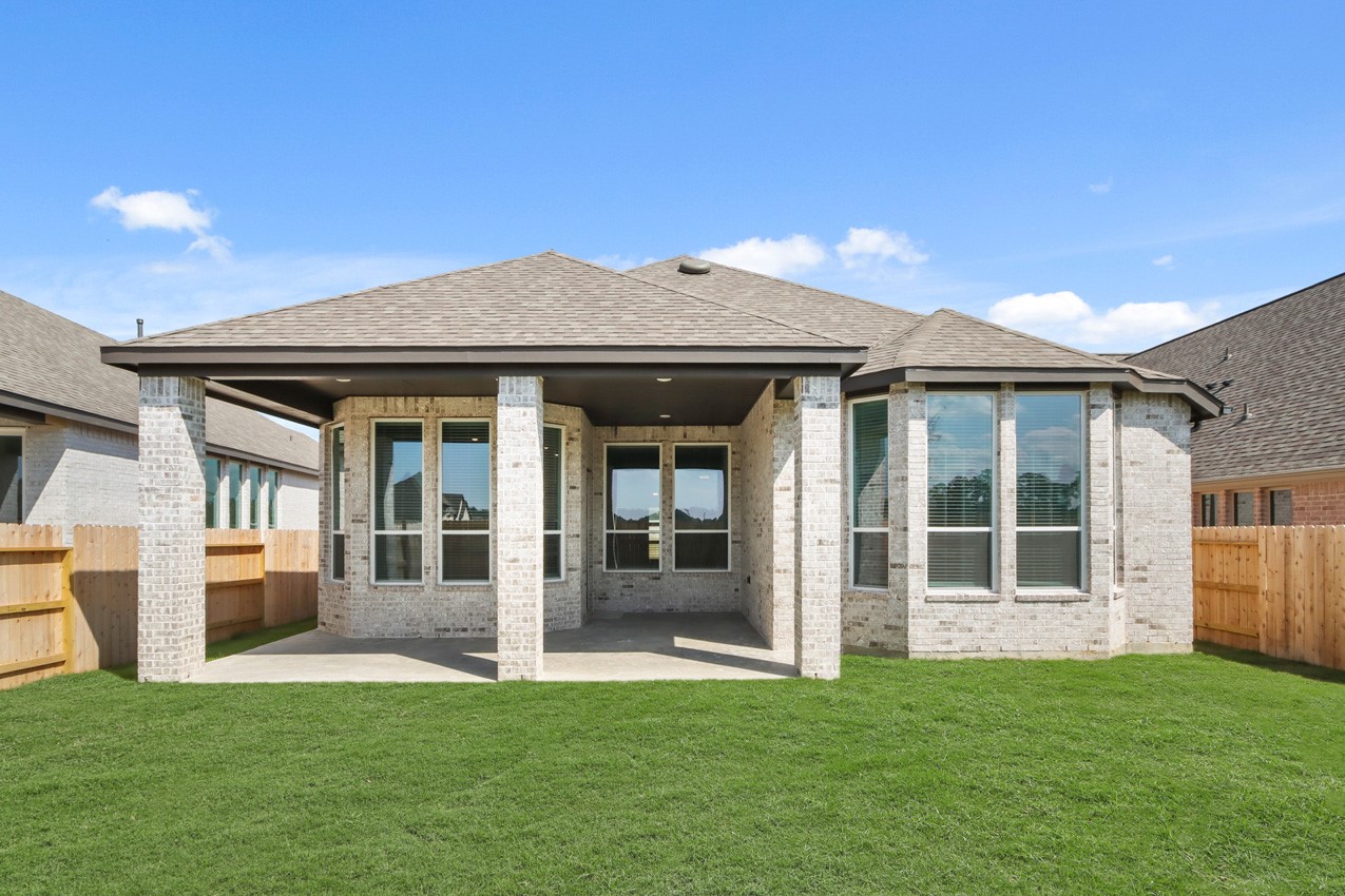 16538 Mandora Lane Conroe, TX 77302 - Photo 16 of 22 a view of an house with backyard porch and entertaining space