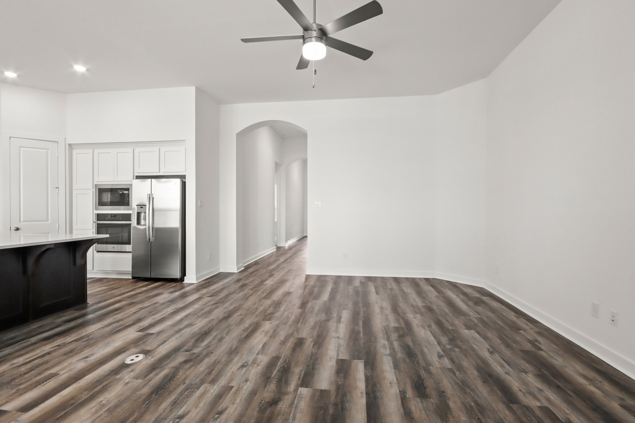 16538 Mandora Lane Conroe, TX 77302 - Photo 9 of 22 a view of kitchen with wooden floor electronic appliances and window