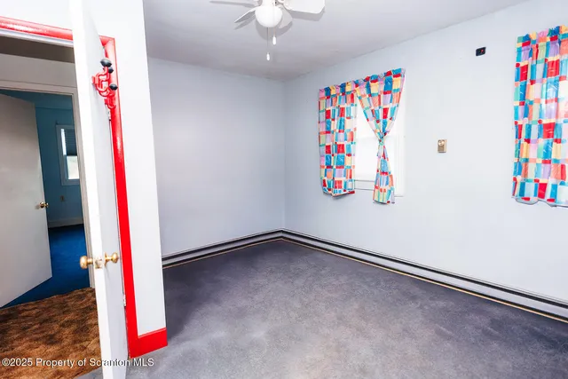 a very nice looking bedroom with a bed and a window