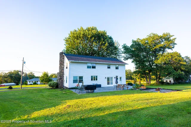 a view of a house with a big yard