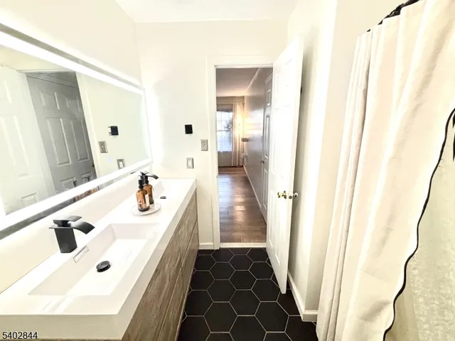 a bathroom with a sink and a mirror
