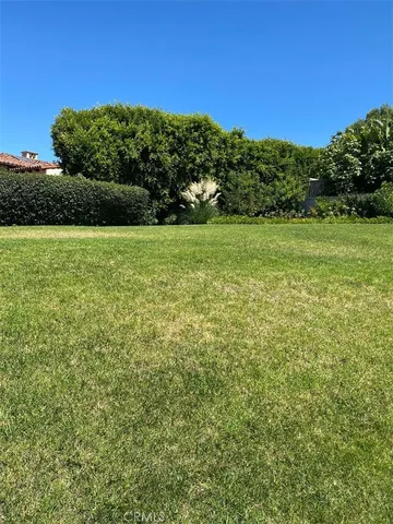 a view of a field with an ocean