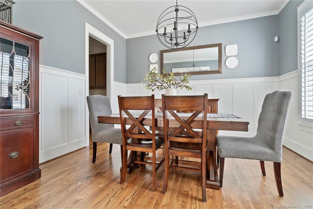 436 Hollyhock Lane Fort Mill, SC 29708 - Photo 8 of 34 a view of a dining room with furniture wooden floor and chandelier
