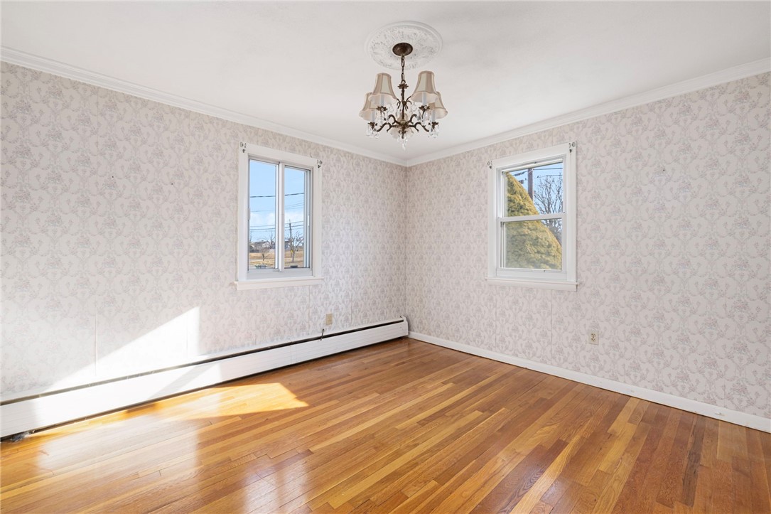 39 Holiday Avenue Warwick, RI 02888 - Photo 13 of 35 The second of three bedrooms features gleaming hardwood floors and double windows.