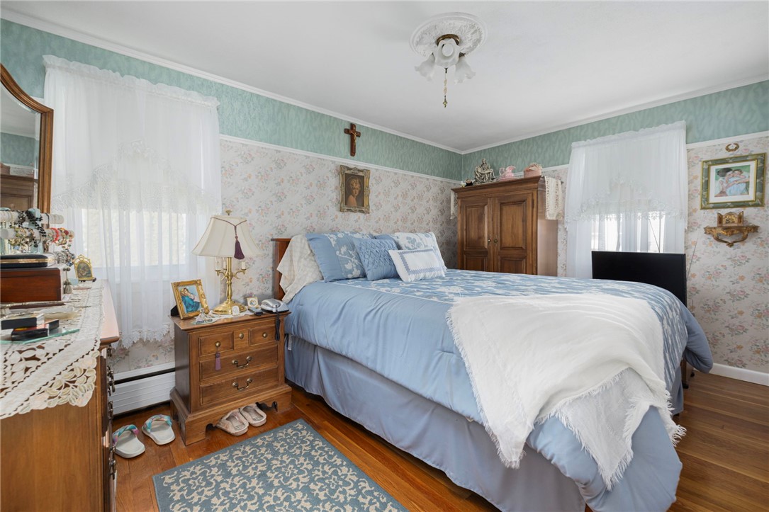 39 Holiday Avenue Warwick, RI 02888 - Photo 15 of 35 The main bedroom is able to accommodate multiple pieces of large furniture and offers double windows for lots of natural light.