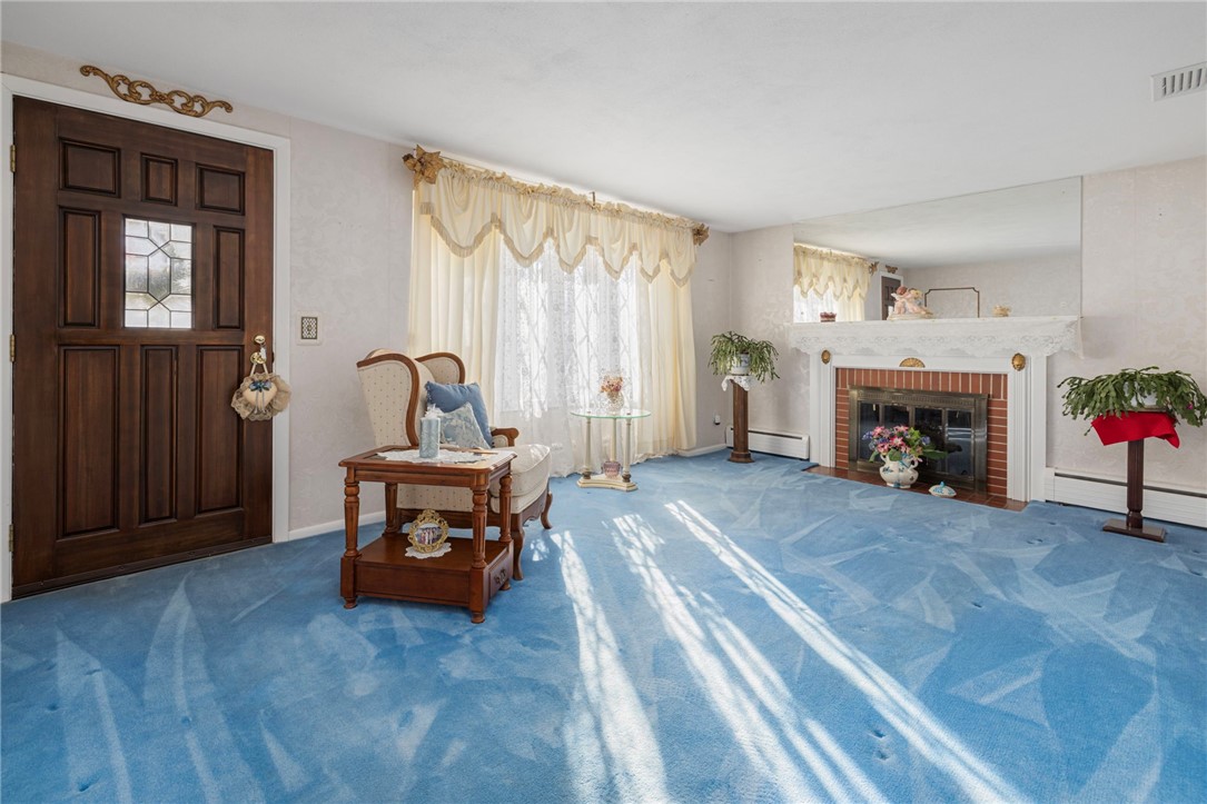 39 Holiday Avenue Warwick, RI 02888 - Photo 18 of 35 The lovely formal living room offers a large picture window and a wood burning fireplace.