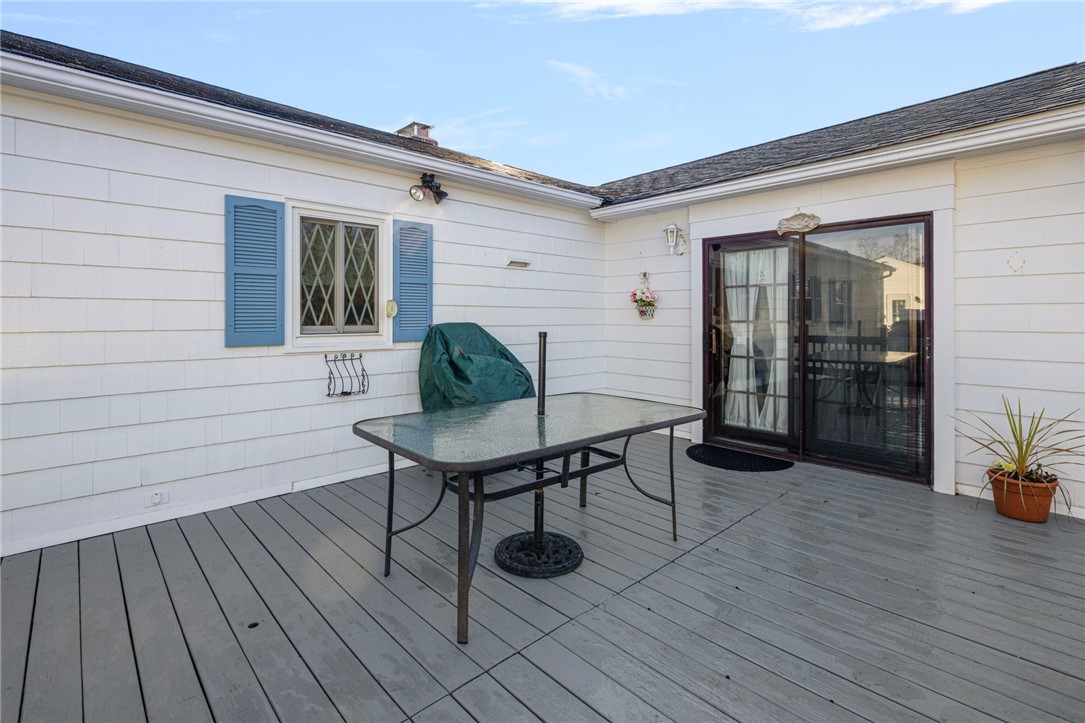 39 Holiday Avenue Warwick, RI 02888 - Photo 25 of 35 The deck can be accessed through a set of french doors through the den/dining area.