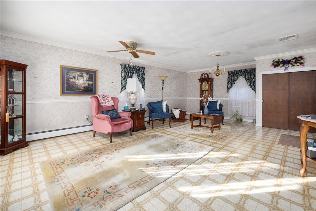 39 Holiday Avenue Warwick, RI 02888 - Photo 5 of 35 Another perspective of den shows its impressive size. This room also accommdated a dining area that is able to fit larger dining room sets.