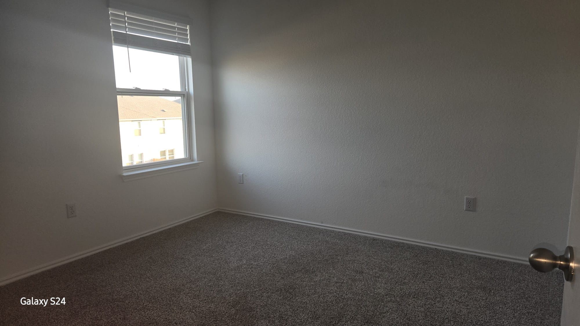 14821 Perlino Way, Unit A Manor, TX 78653 - Photo 12 of 20 an empty room with a window