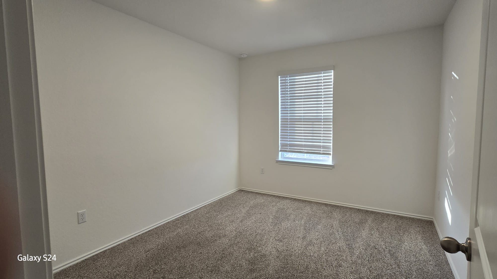 14821 Perlino Way, Unit A Manor, TX 78653 - Photo 17 of 20 an empty room with a window