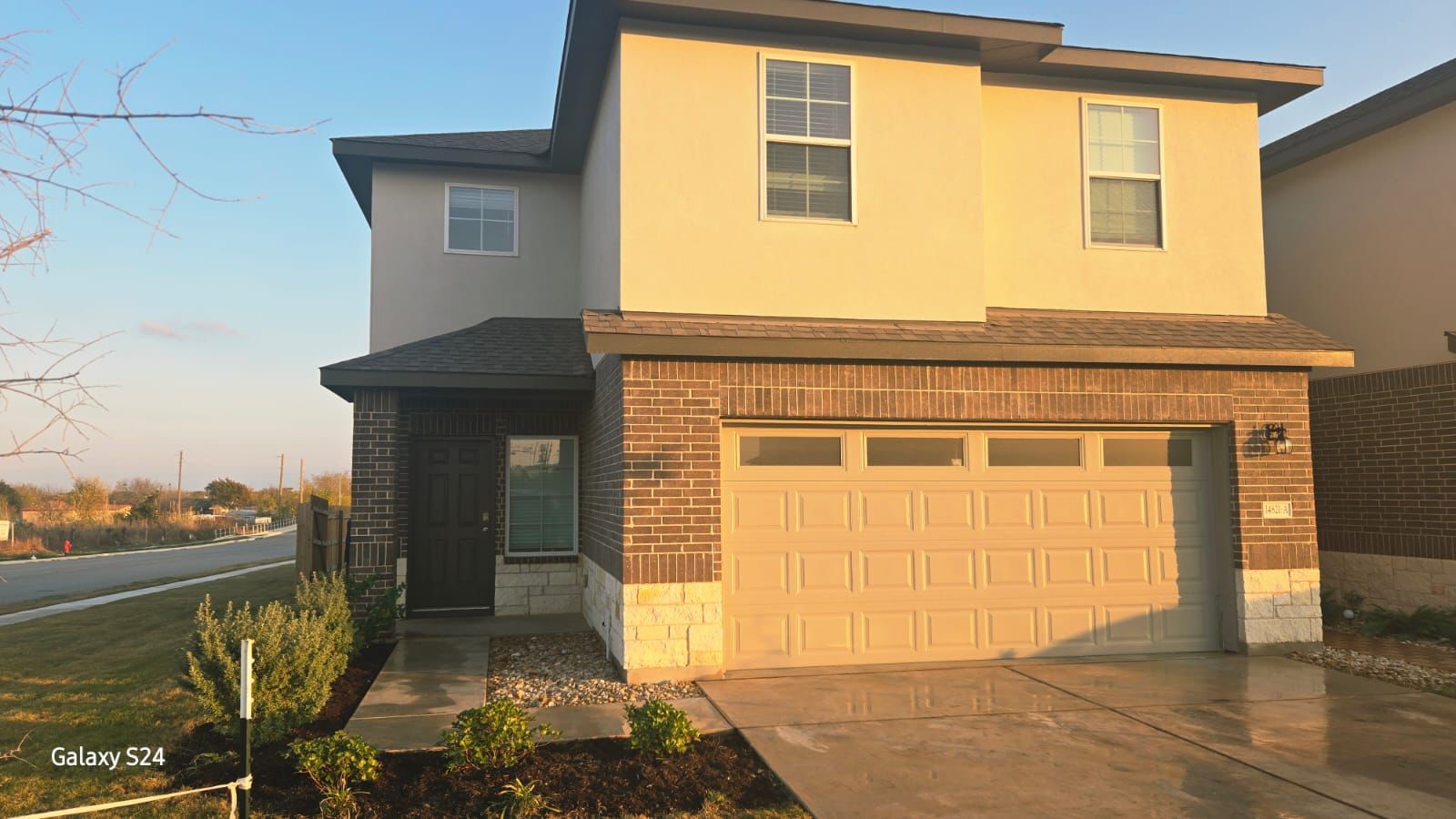 14821 Perlino Way, Unit A Manor, TX 78653 - Photo 2 of 20 a front view of a house with a yard