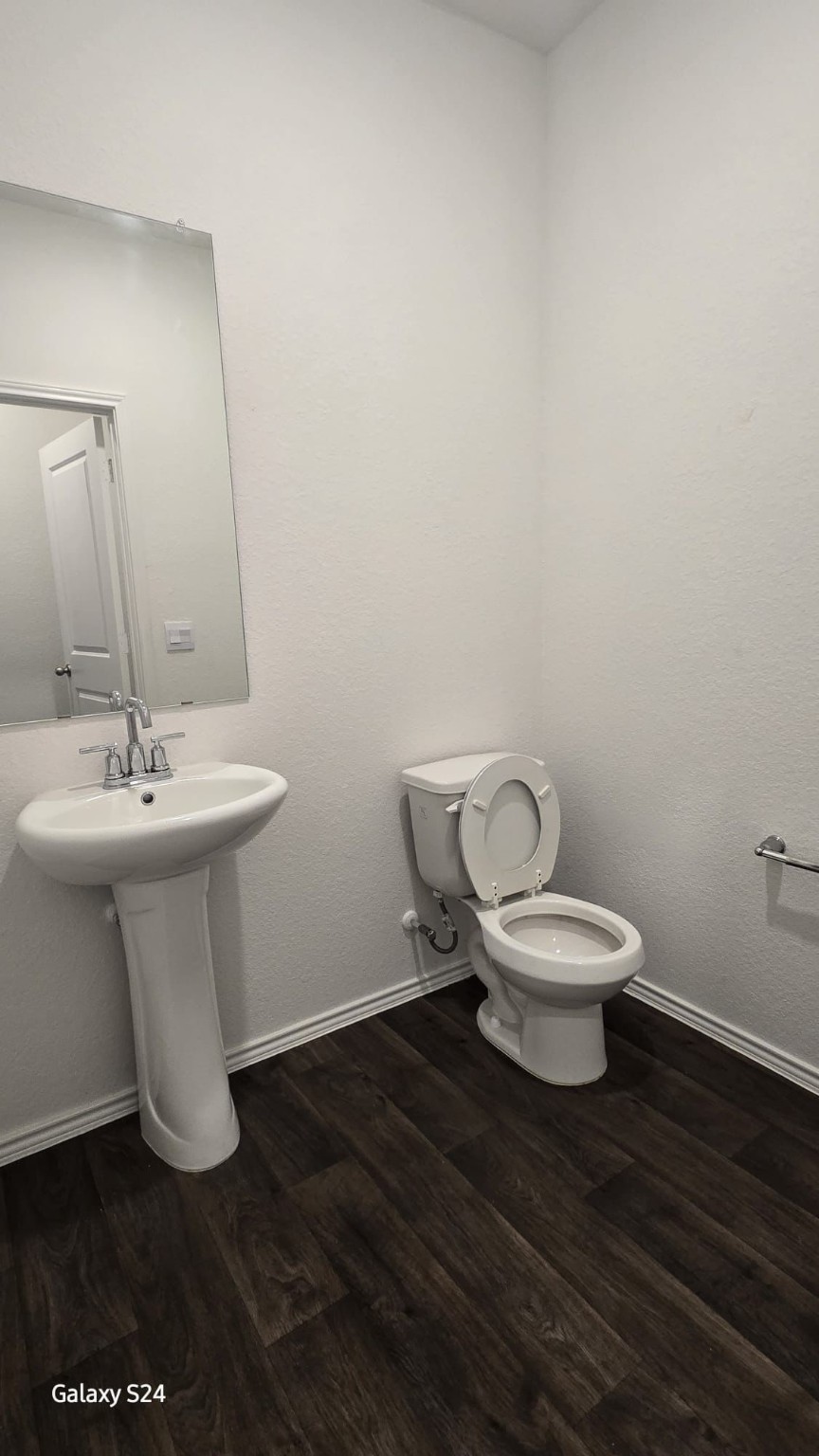 14821 Perlino Way, Unit A Manor, TX 78653 - Photo 10 of 20 a bathroom with a sink and a toilet