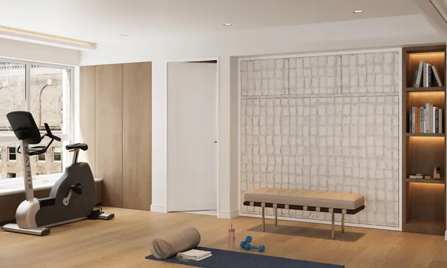 a room with a table chairs and wooden floor