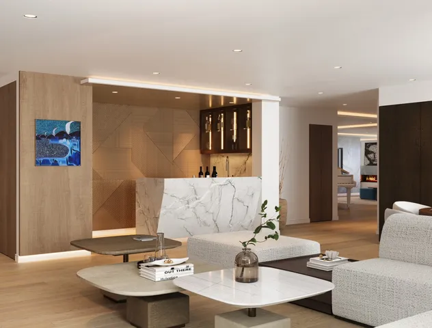 a living room with furniture a mirror and a wooden floor