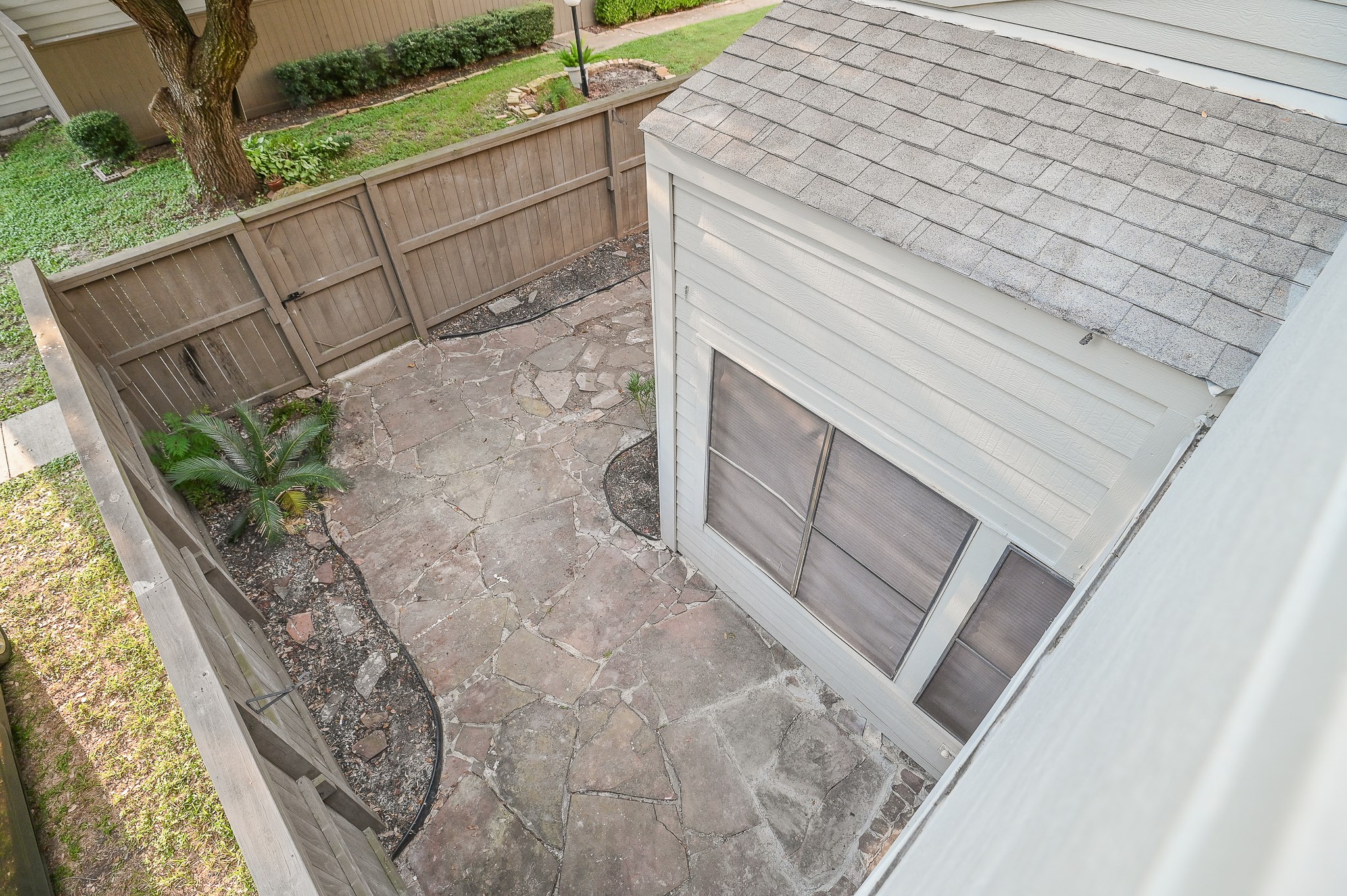 1619 Prairie Mark Lane Houston, TX 77077 - Photo 20 of 25 a view of a backyard