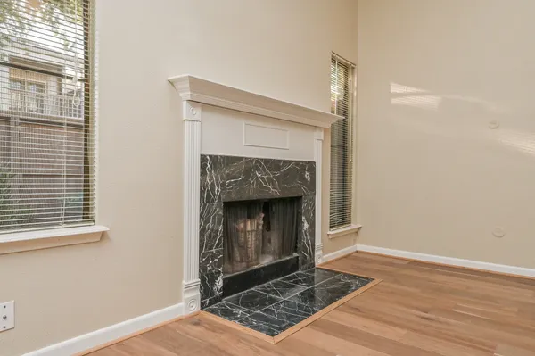 a living room with a fireplace and a table