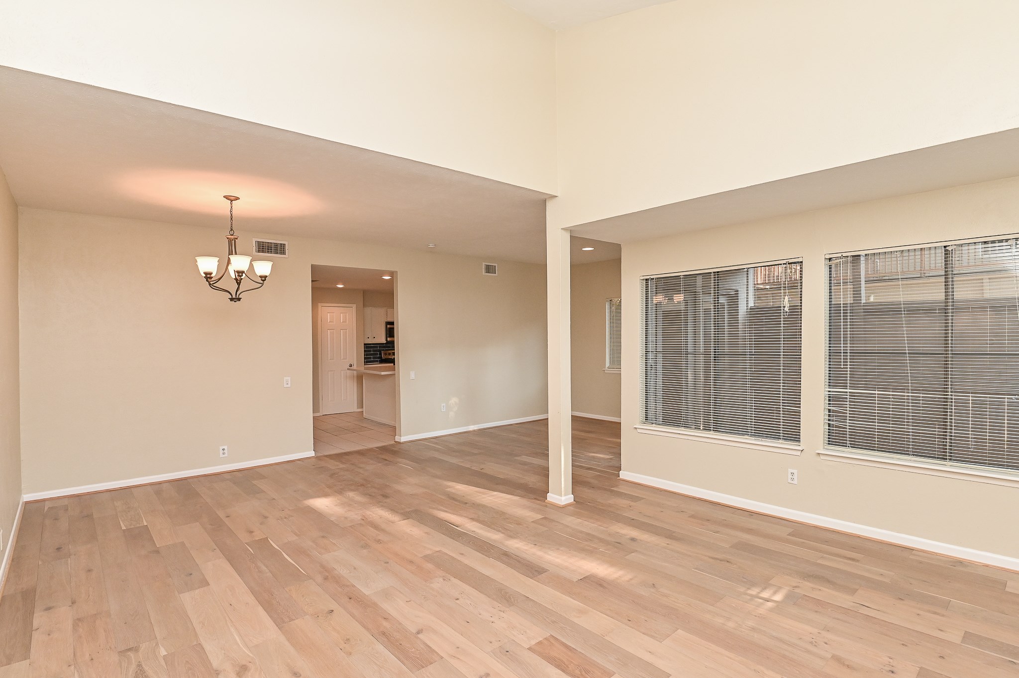 1619 Prairie Mark Lane Houston, TX 77077 - Photo 9 of 25 a view of empty room with wooden floor and fan