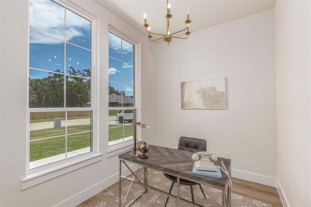 360 Dalton Road Canton, TX 75103 - Photo 4 of 33 Dedicated space featuring two large grid-pattern windows, a modern chandelier, light-toned walls, and wood-finish flooring
