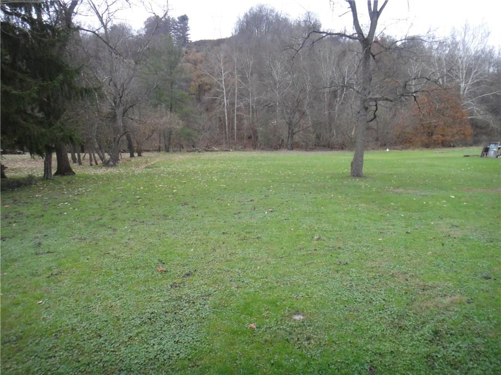 Beautiful level one acre lot with creek 