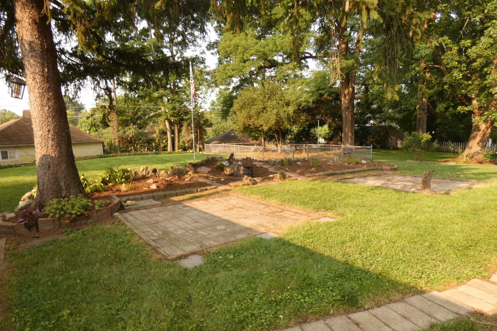109 Crescent Road Fox River Grove, IL 60021 - Photo 2 of 4 a view of a yard with a tree