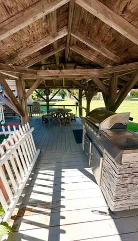 a view of a patio with table and chairs