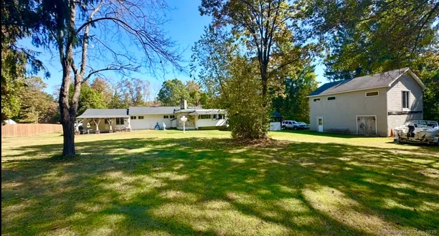 a view of a house with a big yard