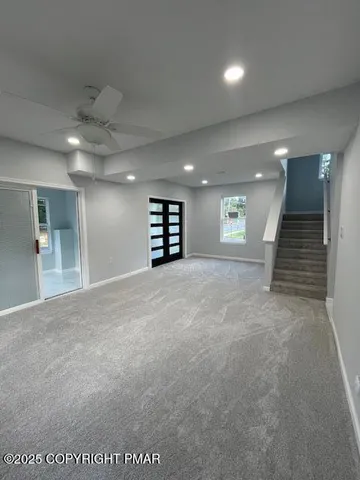 an empty room with windows and pillars in it