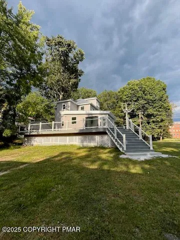 a view of a swimming pool with an outdoor space and seating area