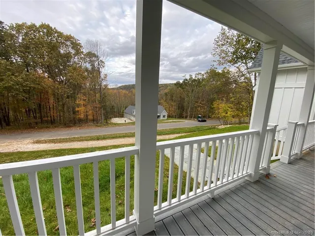 a view of balcony with wooden floor