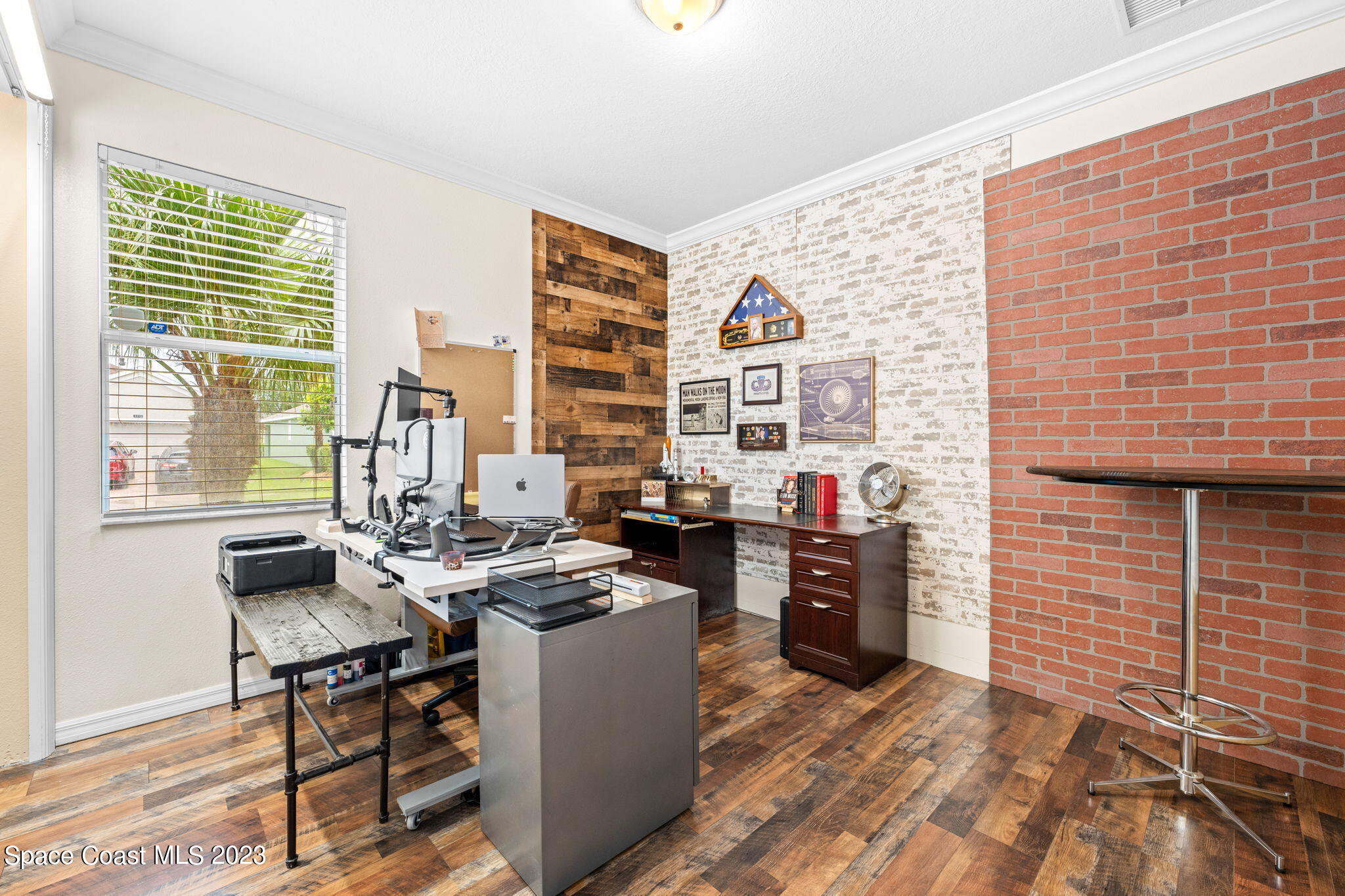 6265 Trieda Drive Melbourne, FL 32940 - Photo 14 of 26 a view of a workspace with furniture and a window
