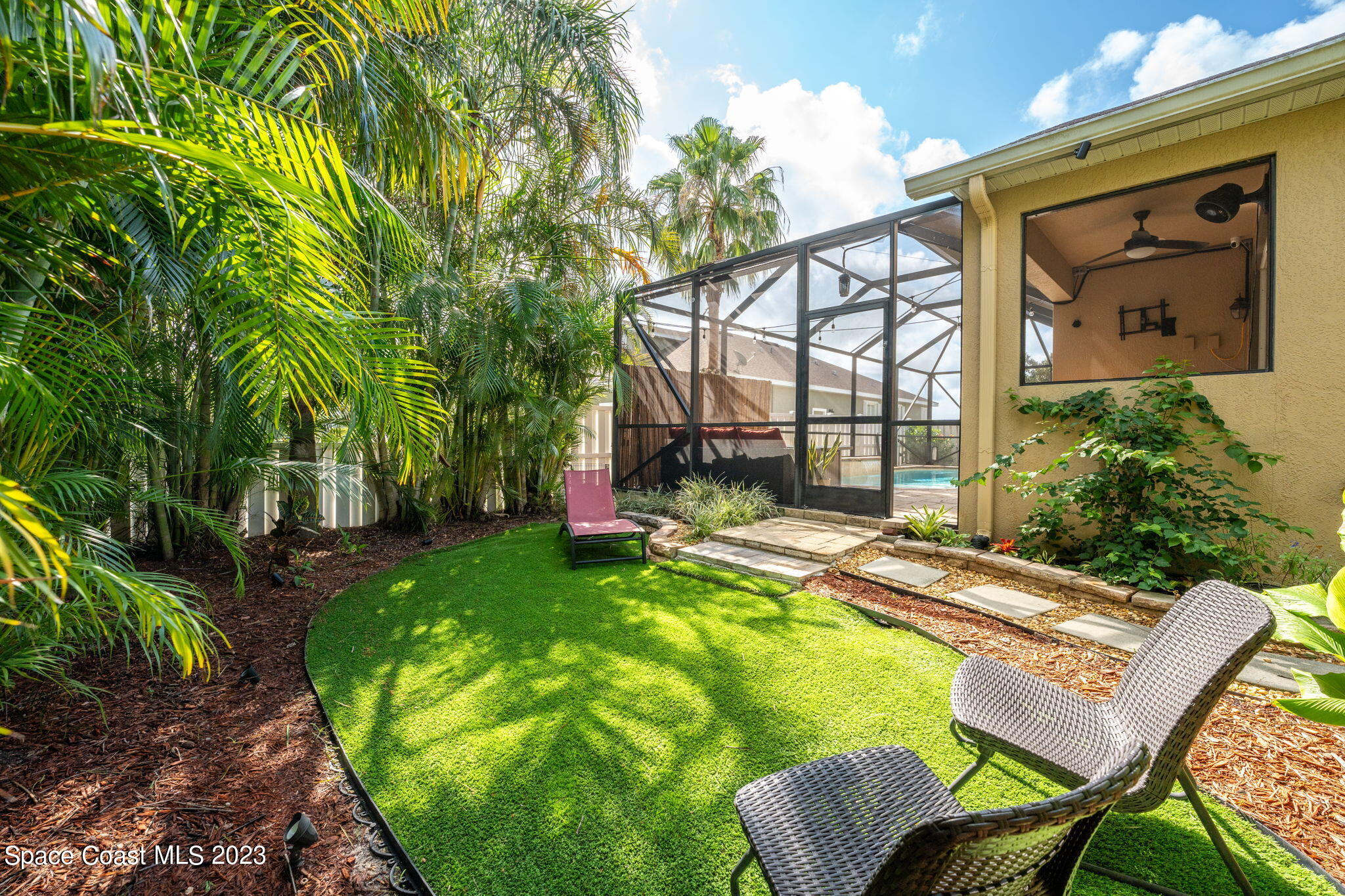 6265 Trieda Drive Melbourne, FL 32940 - Photo 20 of 26 a view of a two chairs in the patio