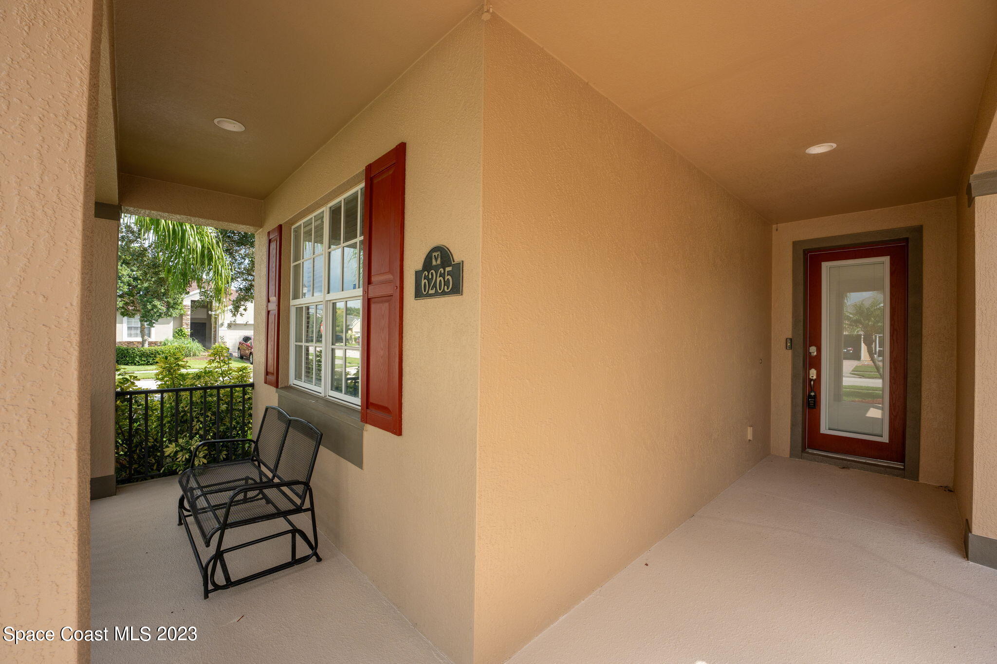 6265 Trieda Drive Melbourne, FL 32940 - Photo 2 of 26 a view of an entryway with wooden floor and a door