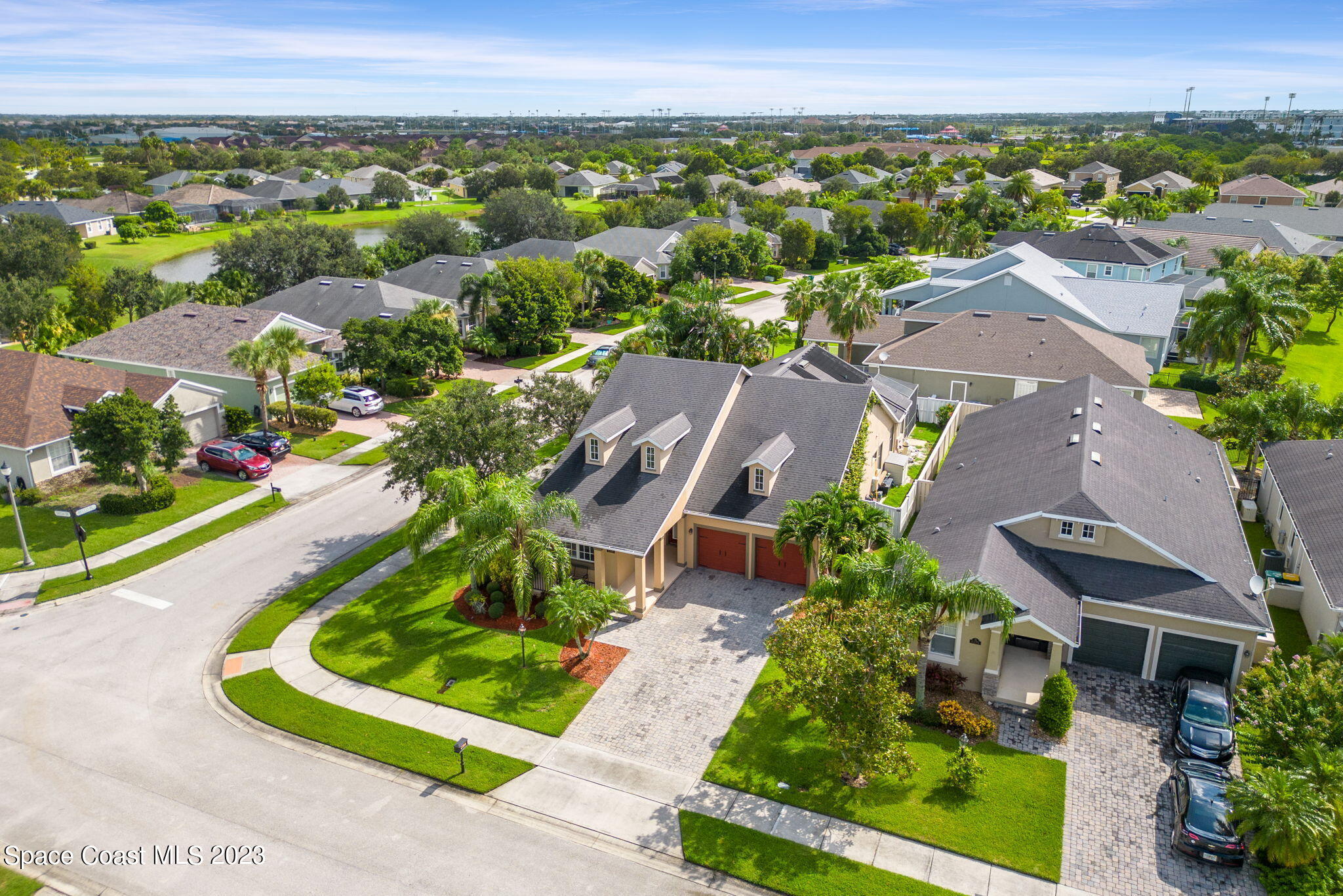 6265 Trieda Drive Melbourne, FL 32940 - Photo 23 of 26 an aerial view of a house with a garden