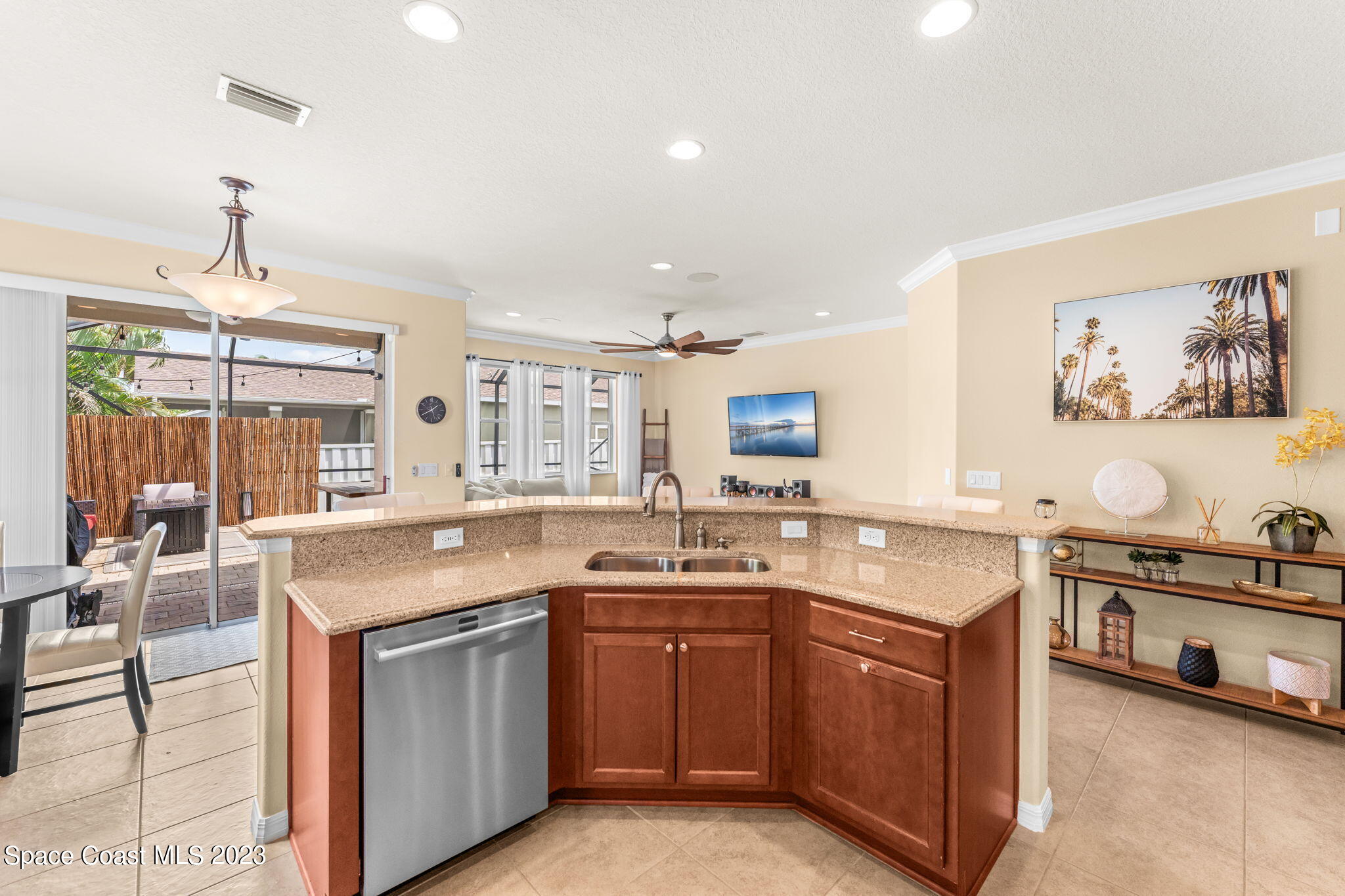6265 Trieda Drive Melbourne, FL 32940 - Photo 6 of 26 a kitchen with a sink stove and cabinets