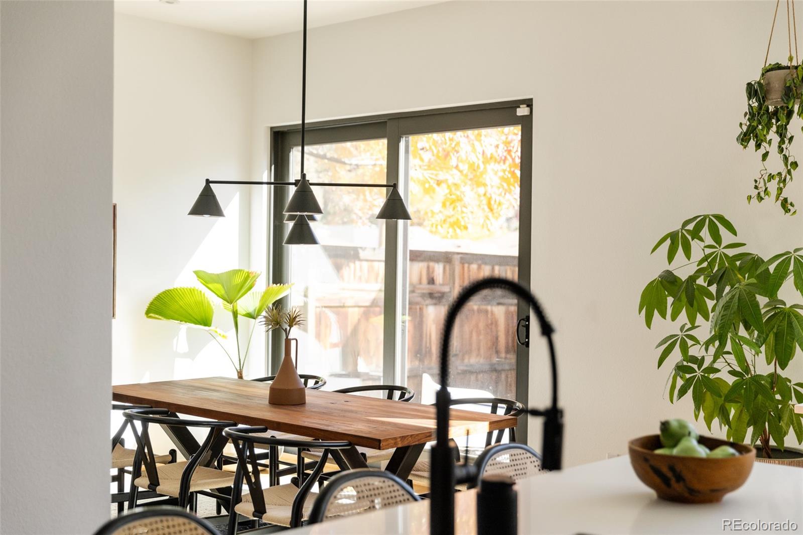 2696 Meade Street Denver, CO 80211 - Photo 12 of 46 a dining room with furniture and window