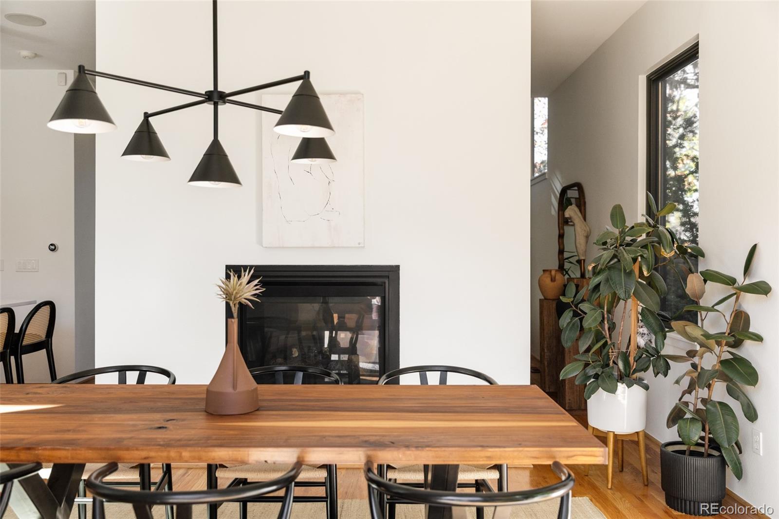 2696 Meade Street Denver, CO 80211 - Photo 14 of 46 a view of a dining room with furniture and wooden floor