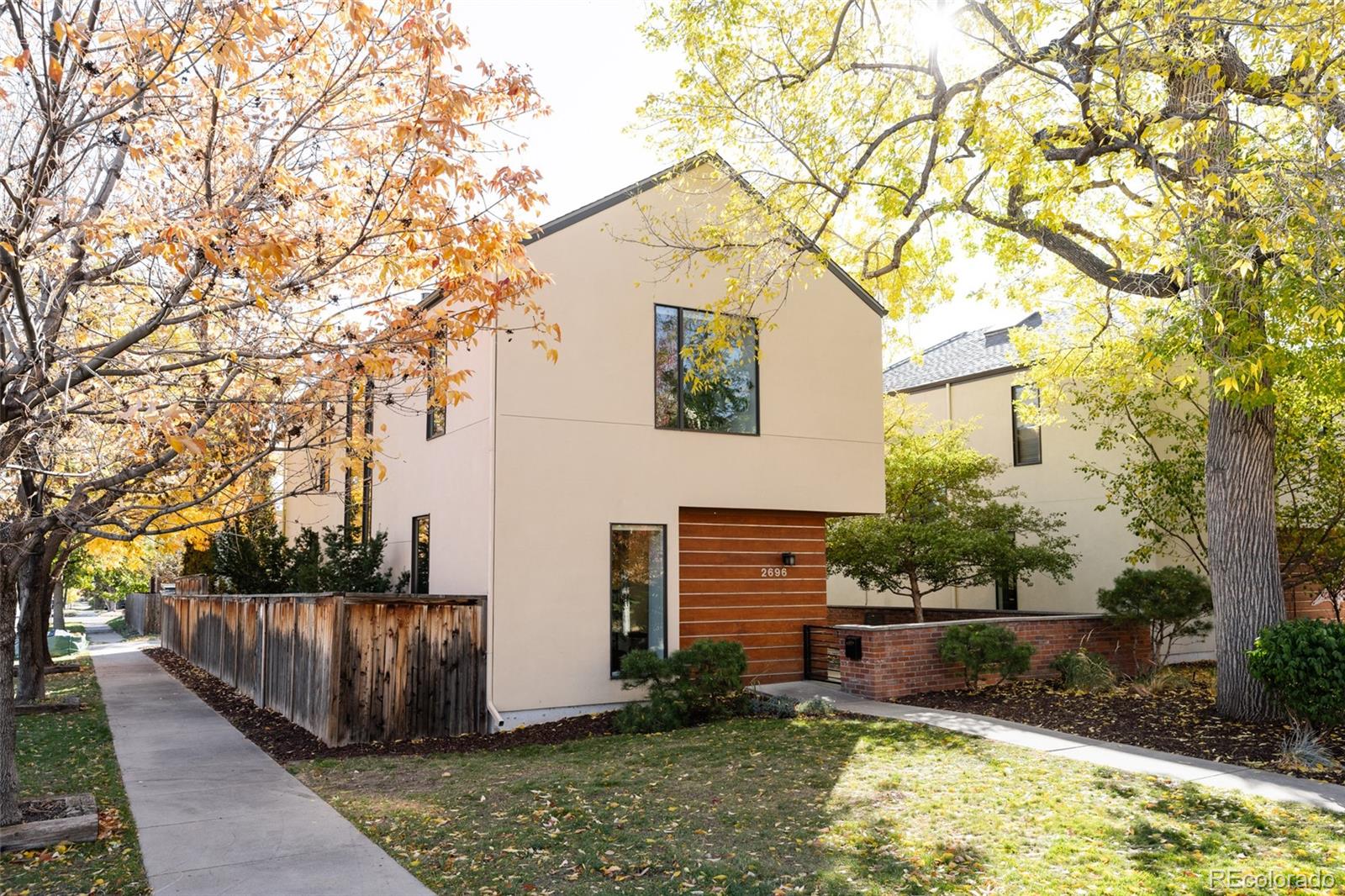 2696 Meade Street Denver, CO 80211 - Photo 2 of 46 a front view of a house with garden