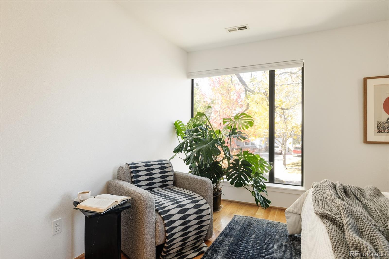 2696 Meade Street Denver, CO 80211 - Photo 23 of 46 a bedroom with a bed and a window