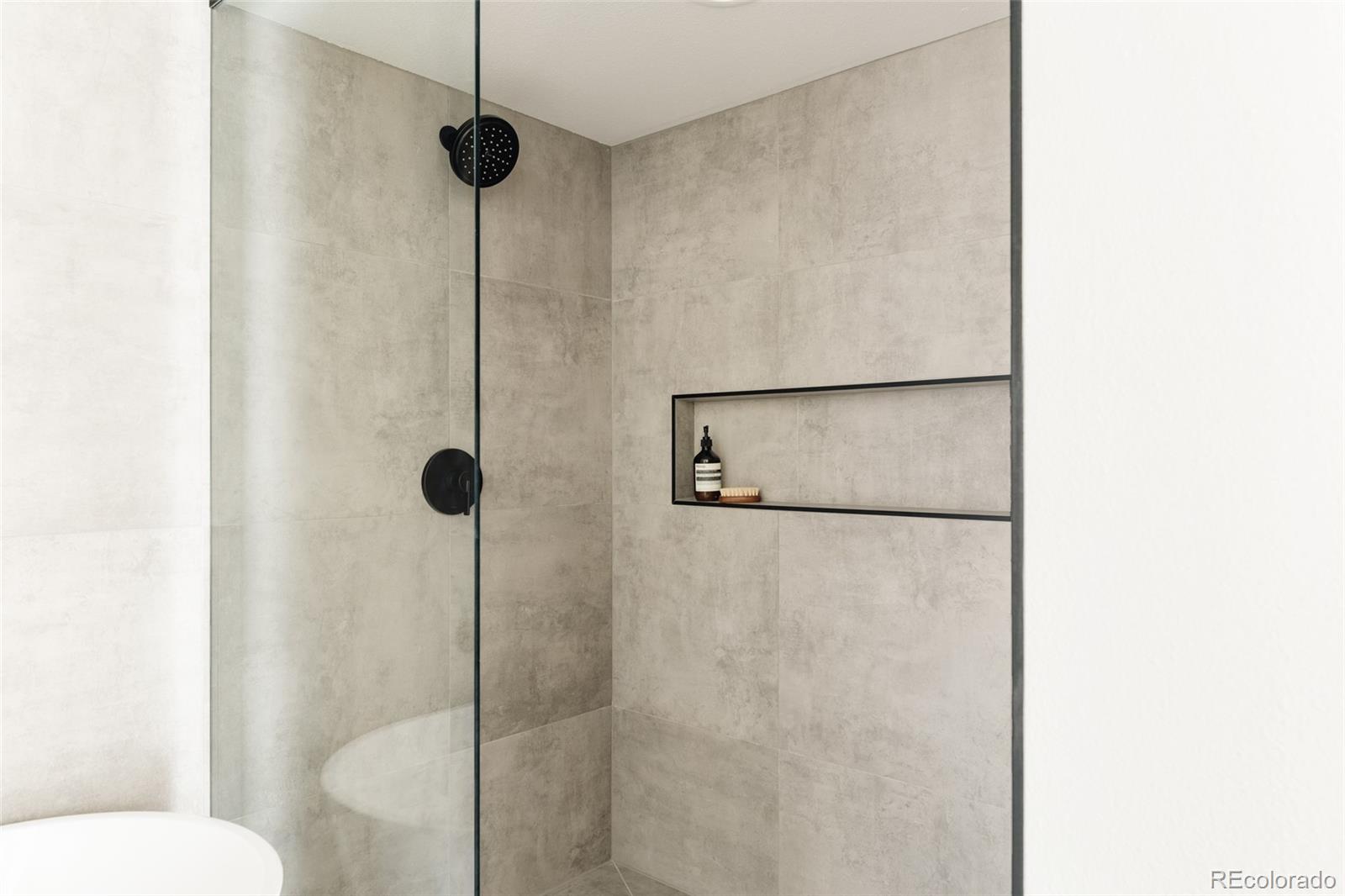 2696 Meade Street Denver, CO 80211 - Photo 25 of 46 a bathroom with a shower