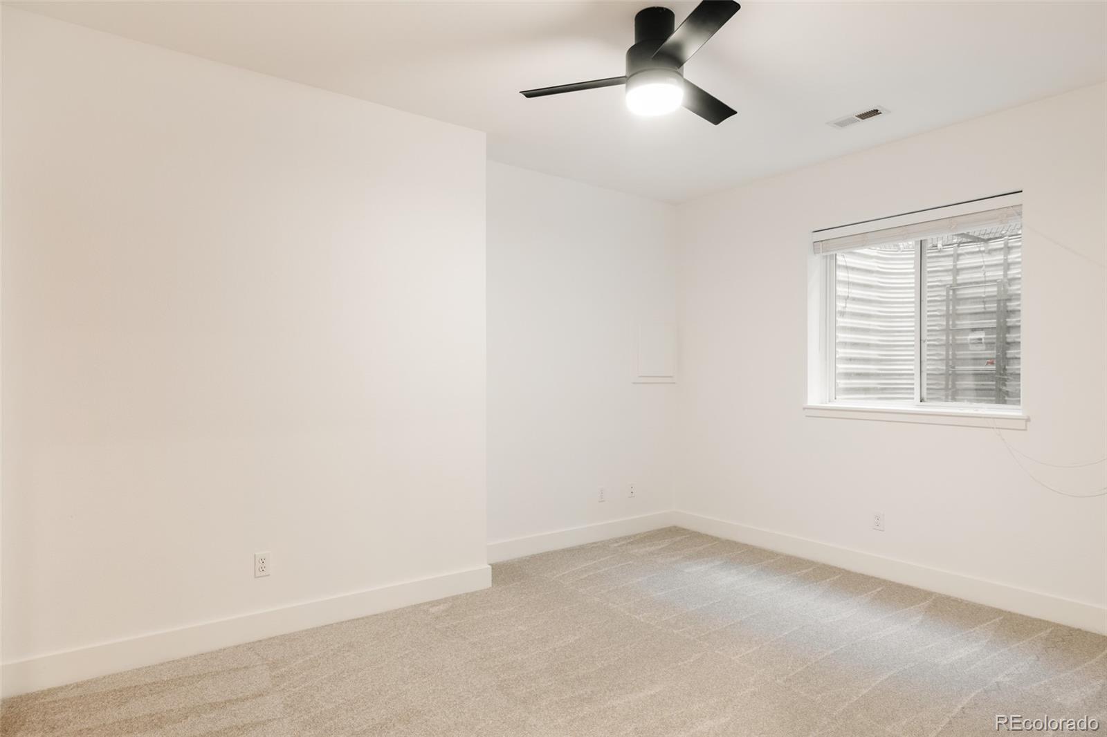 2696 Meade Street Denver, CO 80211 - Photo 38 of 46 an empty room with a window